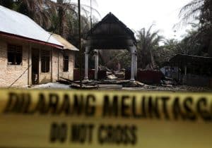 Police tape blocks access to a burned church at Suka Makmur Village in Aceh Singkil