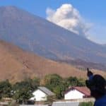 Volcanic ash grounds tourists for third day